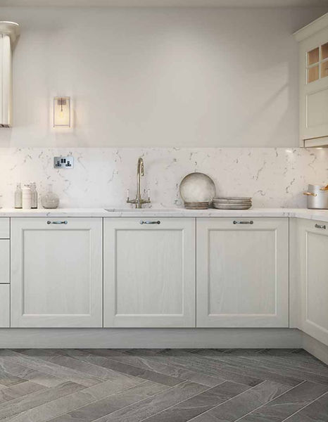 Elegant white Shaker kitchen with marble backsplash