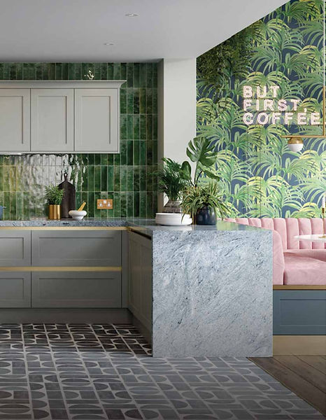Modern kitchen with green tile, tropical wallpaper, and 'Buy First Coffee' sign