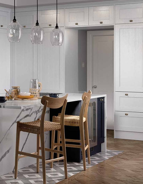 Modern kitchen island with marble top, wooden stools