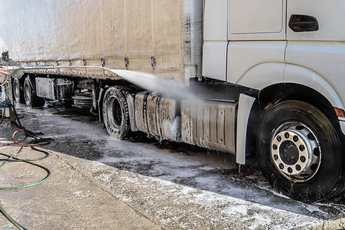 Washing a large truck with car shampoo Background for car service Truck washing outdoors C