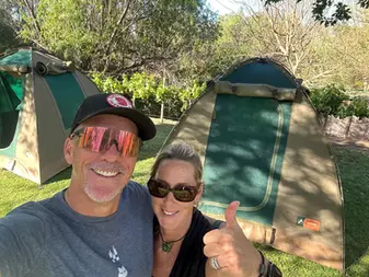 Paul Barrett and wife camping outdoors — retirement transition planning with Absolute Wealth Advisers Sydney