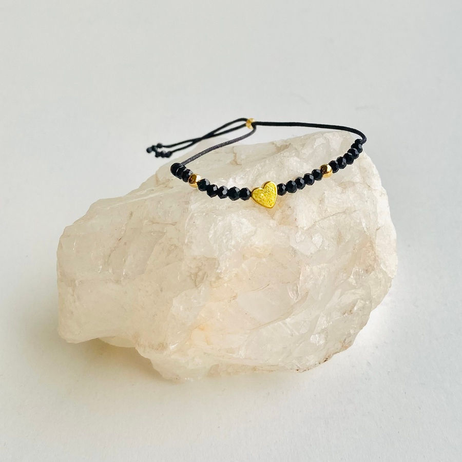 Pulseras negra corazón baño oro