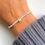 Miniatura: Pulsera gris corazón plata