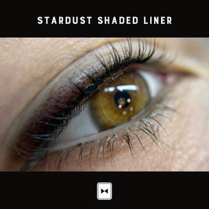 A close-up view of a client's eyes after undergoing Tuxedo Club's shaded liner permanent makeup service. A gradient, soft-lined effect is visible along the upper lash line, with the color gradually deepening towards the outer corners. This shading technique provides a subtle, smoky appearance that enhances the eyes with a natural yet defined look. The overall effect is a beautifully blended, smudge-proof liner that adds depth and dimension, giving the eyes a more polished and captivating appearance.