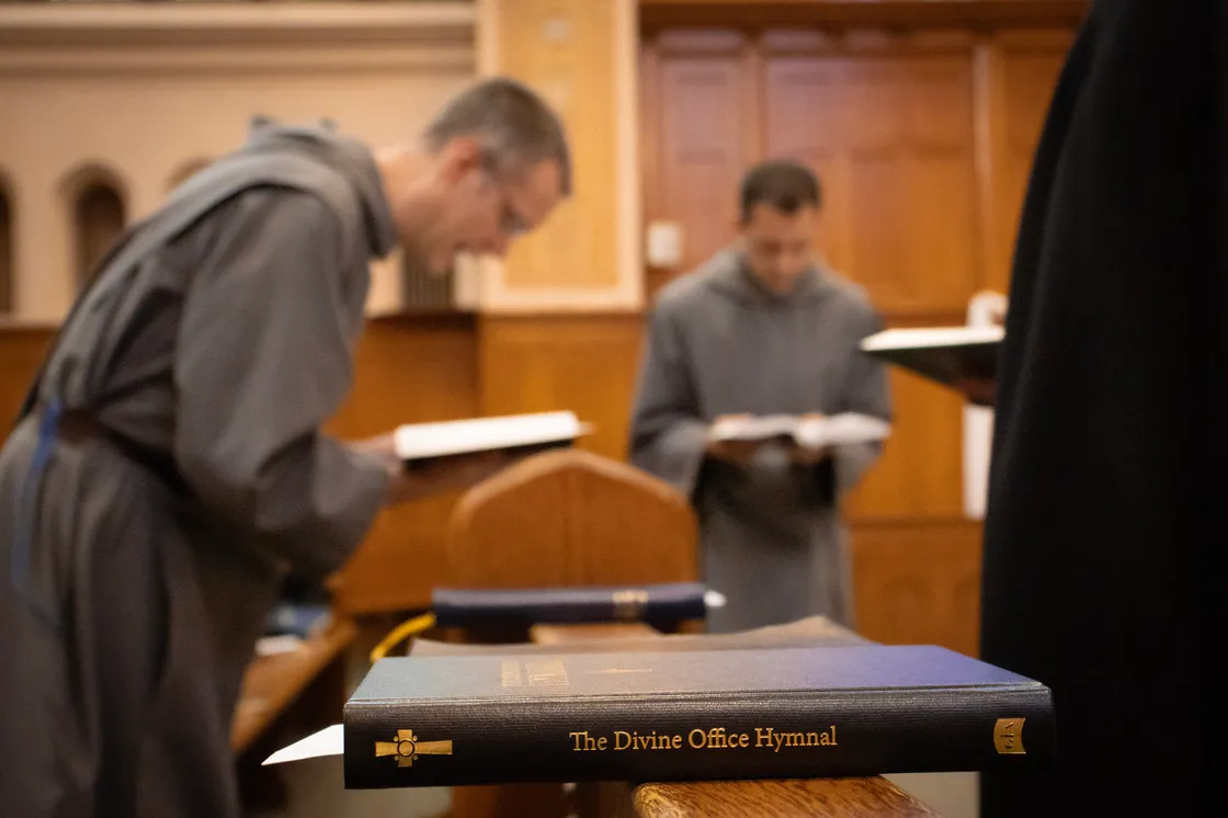 Brothers of St. John chanting the Divine Office in the church