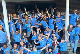 Students at our weeklong theater camp building friendships and celebrating after a musical theater performance.