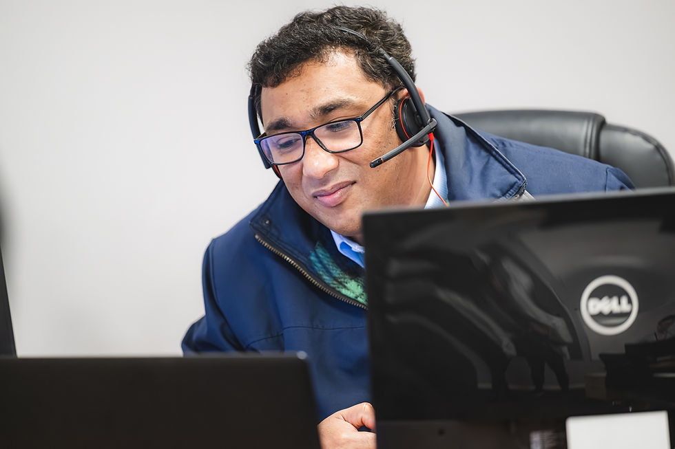 Man sat at desk infront of computer