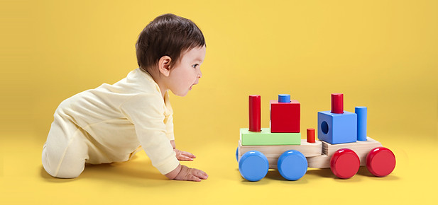 Baby with Wooden Toy