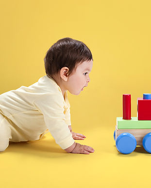 Baby with Wooden Toy