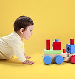 Baby with Wooden Toy