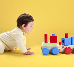 Baby with Wooden Toy