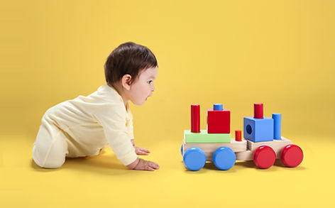 Baby with Wooden Toy