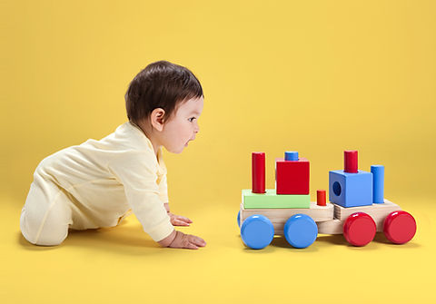 Baby with Wooden Toy