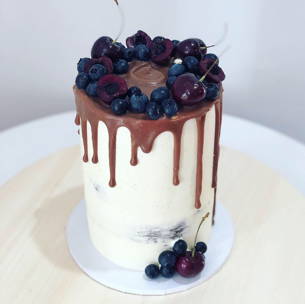 Black forest cake with chocolate drip decorated with seasons fruits
