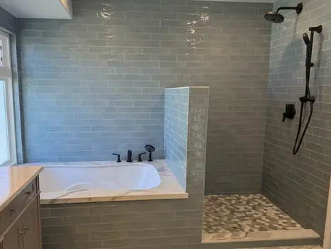 Soaking tub integrated into walk-in shower in Oceanside master bathroom renovation