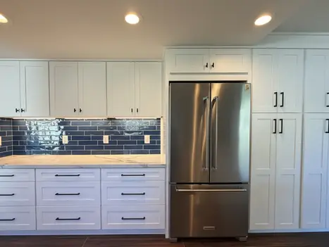 Quartz countertop and blue tile backsplash detail in Oceanside kitchen remodel