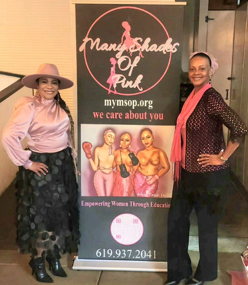 Two women stand on either side of the Many Shades of Pink banner, which reads mymsop.org — we care about you.