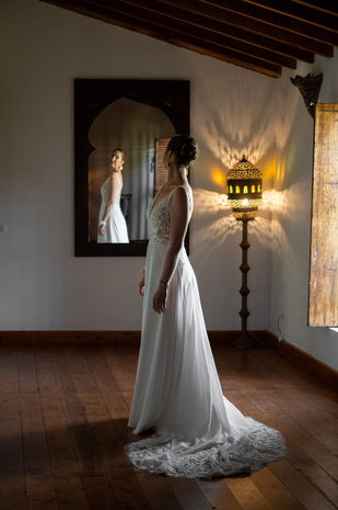 woman bride looking in the mirror of the hacienda in andalucia