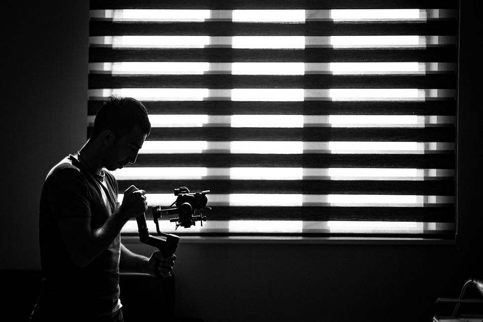 photographer-checking-his-camera-darknes