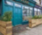 A teal coloured shopfront