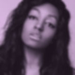 A black and white image of Yasmin, a black woman cis woman with dark hair and winged eyeliner. The highlights are graded a light purple.