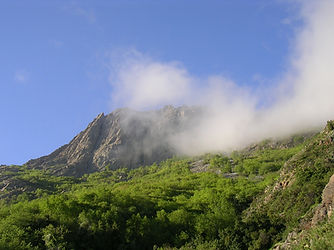 Clouds rolling over the peak of Cerro La Campana, the UNESCO biosphere trek near Santiago