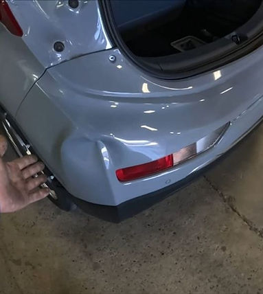 Rear bumper scratch and dent repair