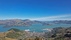2023 New Zealand Sail Grand Prix in Lyttelton: F50 catamarans, mid-race action, 15,000 spectators, and a picturesque backdrop of Christchurch's Ōtautahi.