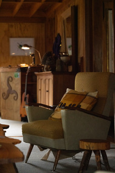 couch in Nydia Bay Track Lodge Kia Ora