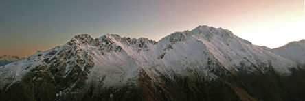 Panoramic view of Mount McIntosh at sunrise with colourful sky and contrasting peaks and shadows - Photography Art Print Frame