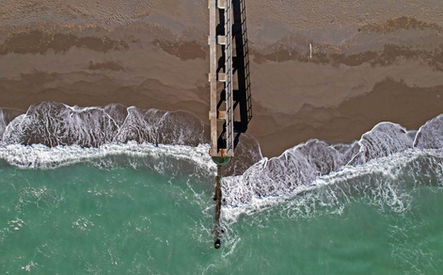 Close-up aerial view of Marlborough Pier Beach showing wave patterns and footprints - Photography Art Print Frame