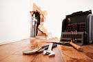 Electronic leak detection tool over a living room floor