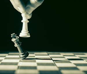 Close up of white king taking down black king_edited.jpg