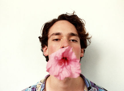 Man with Flower in Mouth