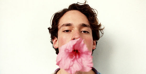 Man with Flower in Mouth