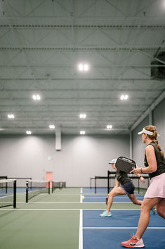 Pickleball court with player's shoes