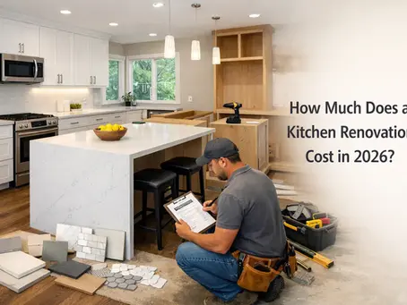 Modern kitchen renovation in progress with quartz island, white cabinets, and contractor reviewing cost plans