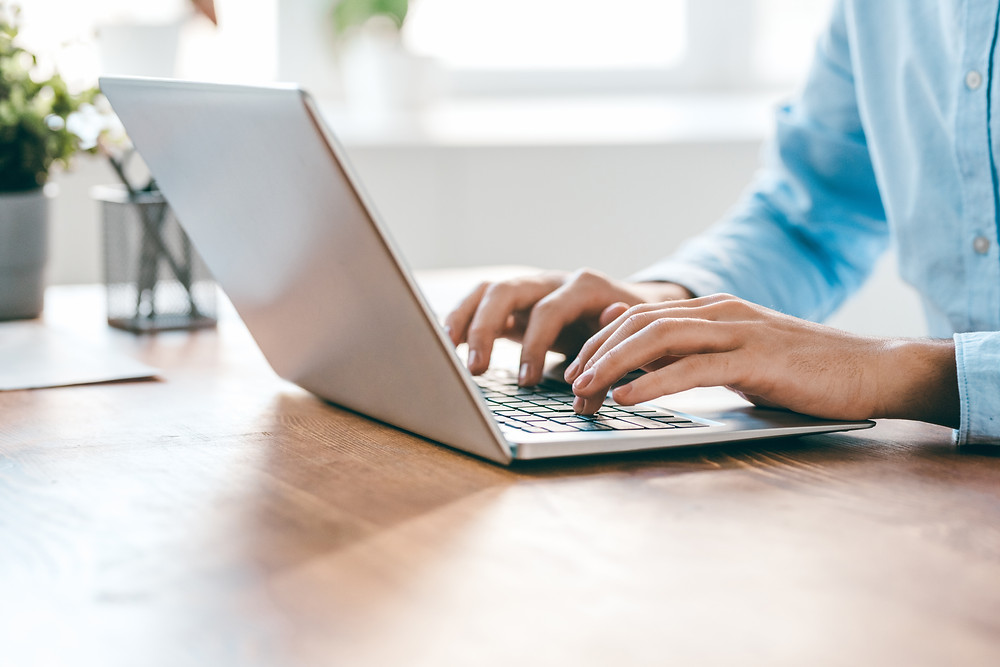 Insurance staff member starts an email campaign to educate their customers about annual review appointments.