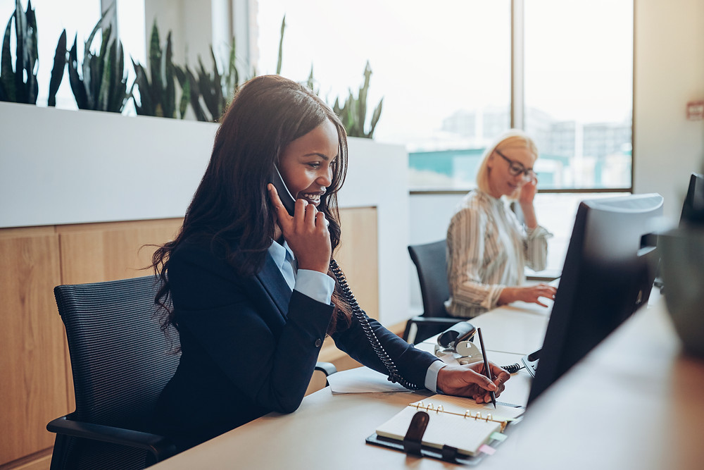 Insurance staff reach out to customers by phone to schedule policy review appointments.