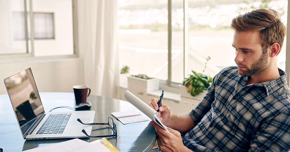 Insurance agent prepares for a client meeting by reviewing their current coverage.