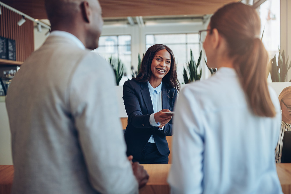 Insurance agent greets mono-lined customers for their review meeting