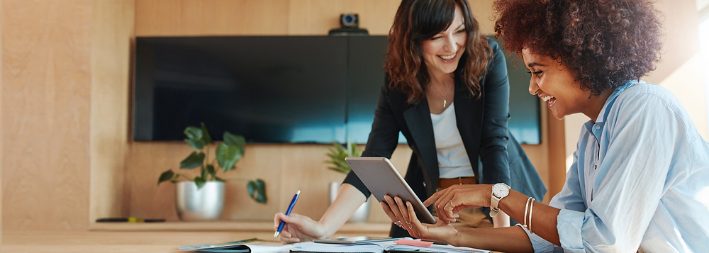 Insurance agency staff sit in the office and review incoming life insurance leads.
