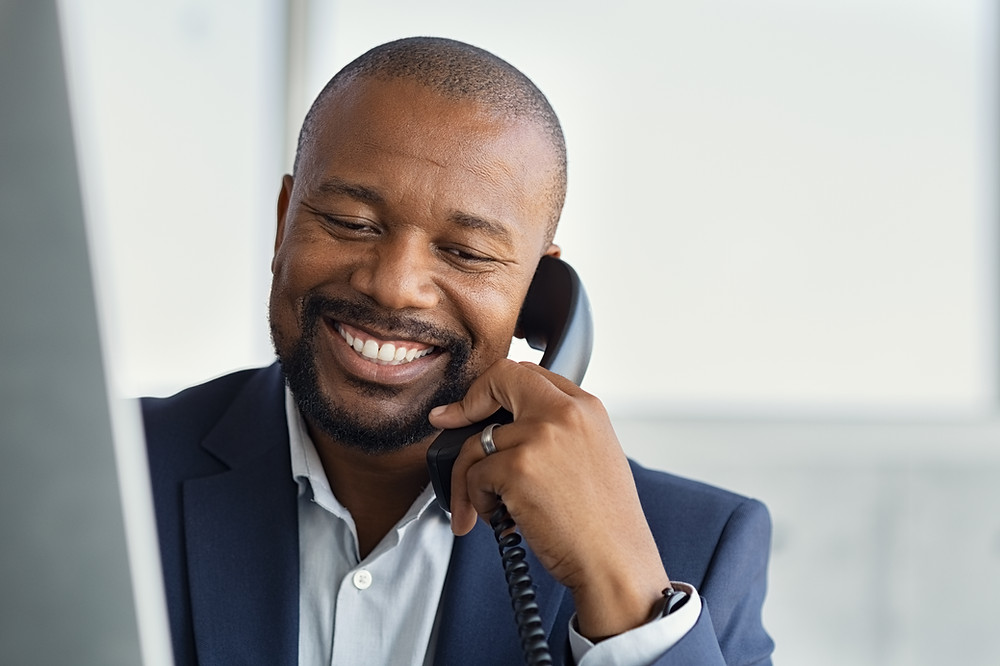 Insurance agency staff member makes calls to clients to increase retention.