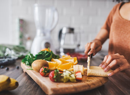 Woman cutting fruit