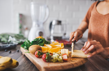 Woman cutting fruit
