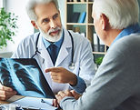 Doctor speaking to elderly patient