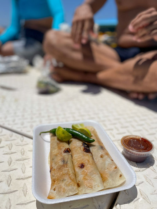 Lunch break on the expedition boat during a day at sea in the Sea of Cortez
