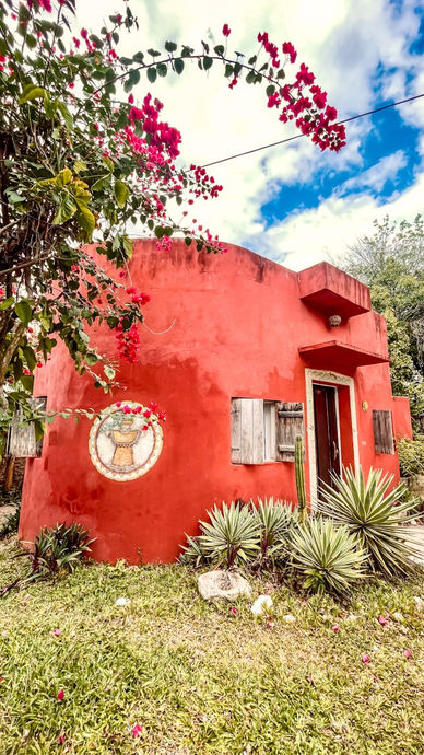 Traditional hacienda surrounded by tropical vegetation in Yucatán, Mexico