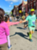 That's my daughter giving a hi-fi to a runner. She had a fun time out there1