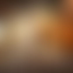 An off-road dirt biker coming thru smoke & fire.